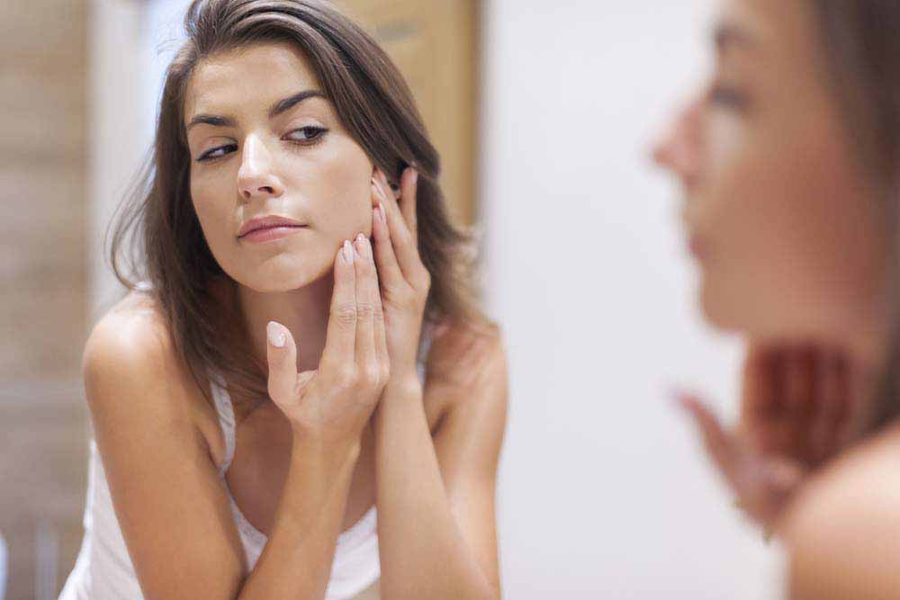 Woman taking care of her skin